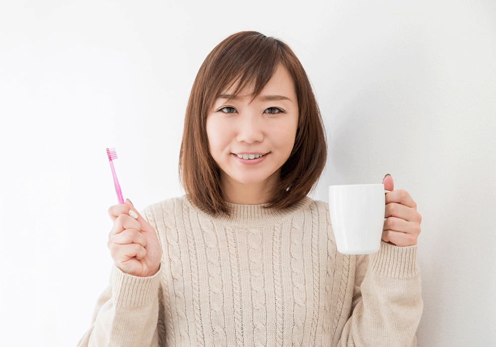 歯ブラシと女性